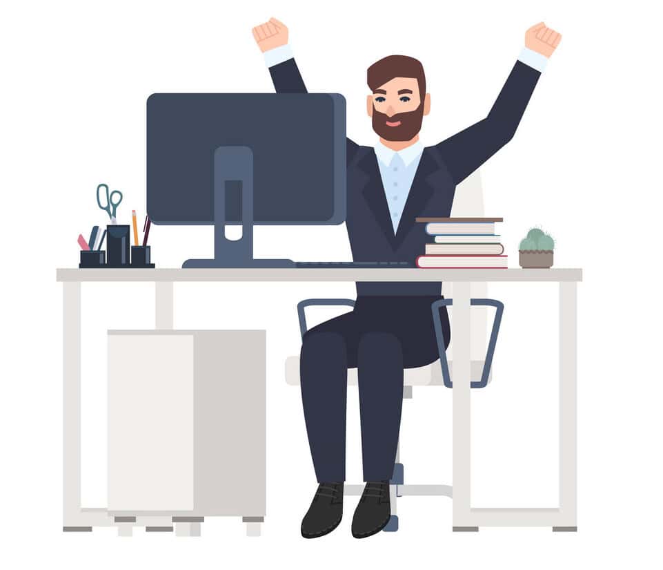 Male office worker or clerk sitting at desk and rejoicing